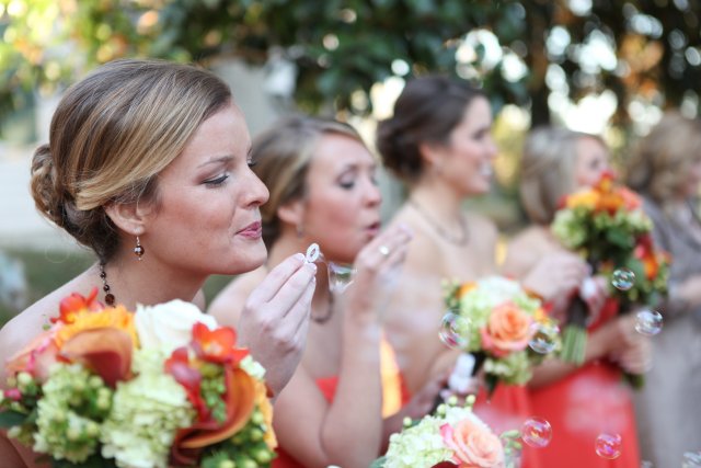 bridesmaids, orange dresses, bubbles, reception, nashville, wedding